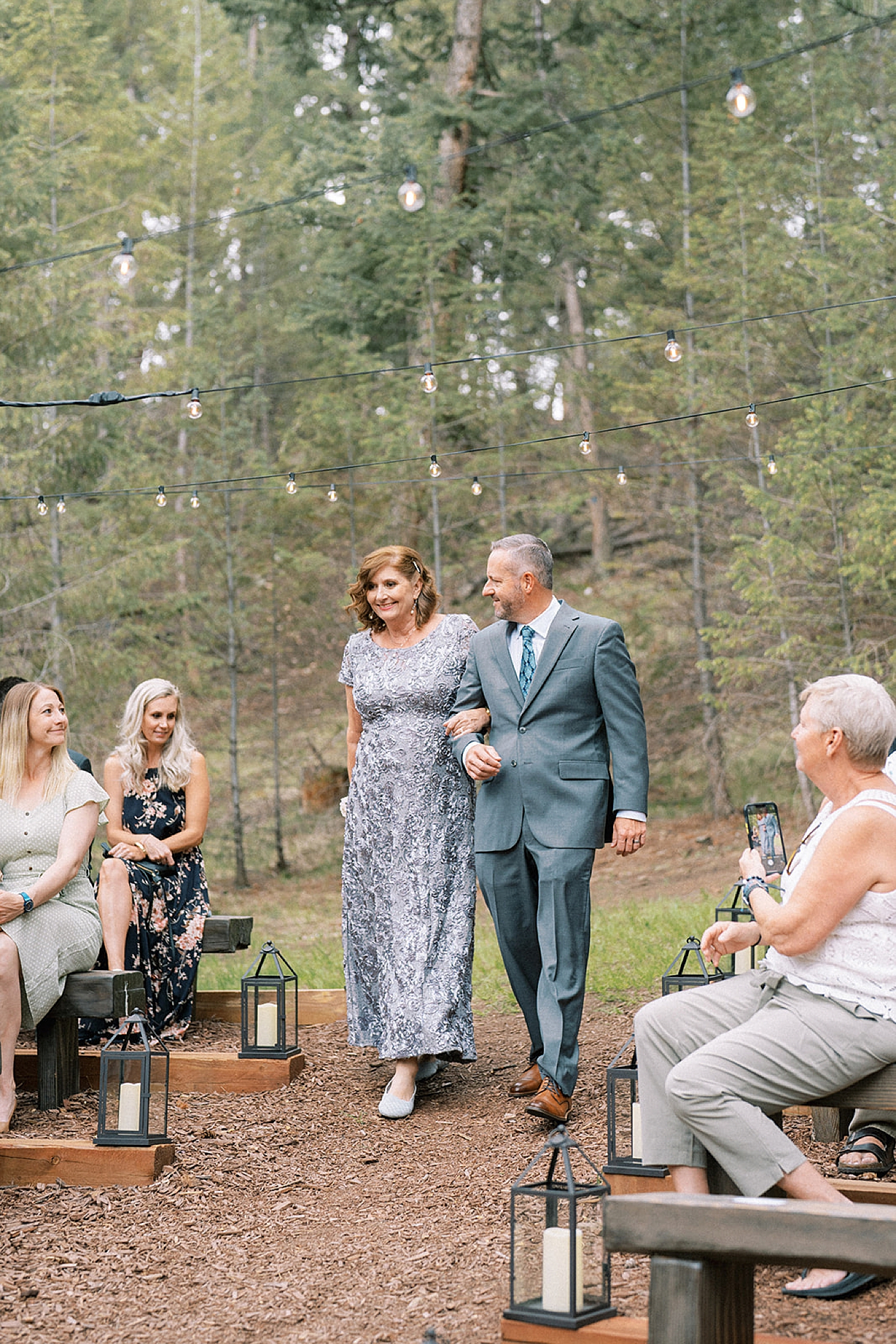 Parents of bride walking down aisle in Colorado | McArthur Weddings and Events