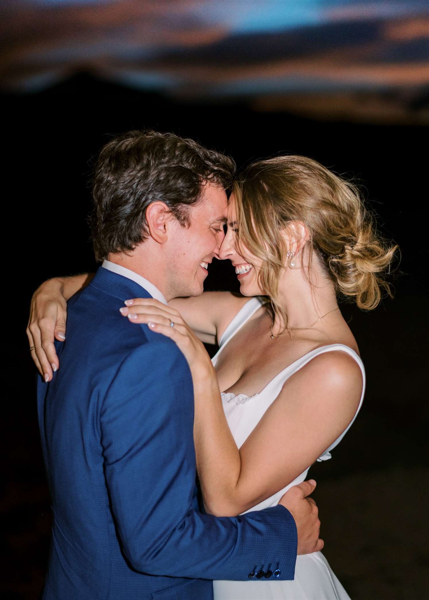 Bride and groom looking at each other at end of night | McArthur Weddings and Events