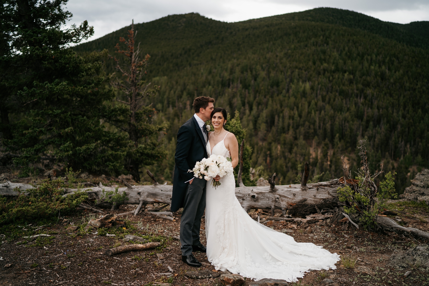 Bride and groom posing in front of mountains at North Star Gatherings | McArthur Weddings and Events