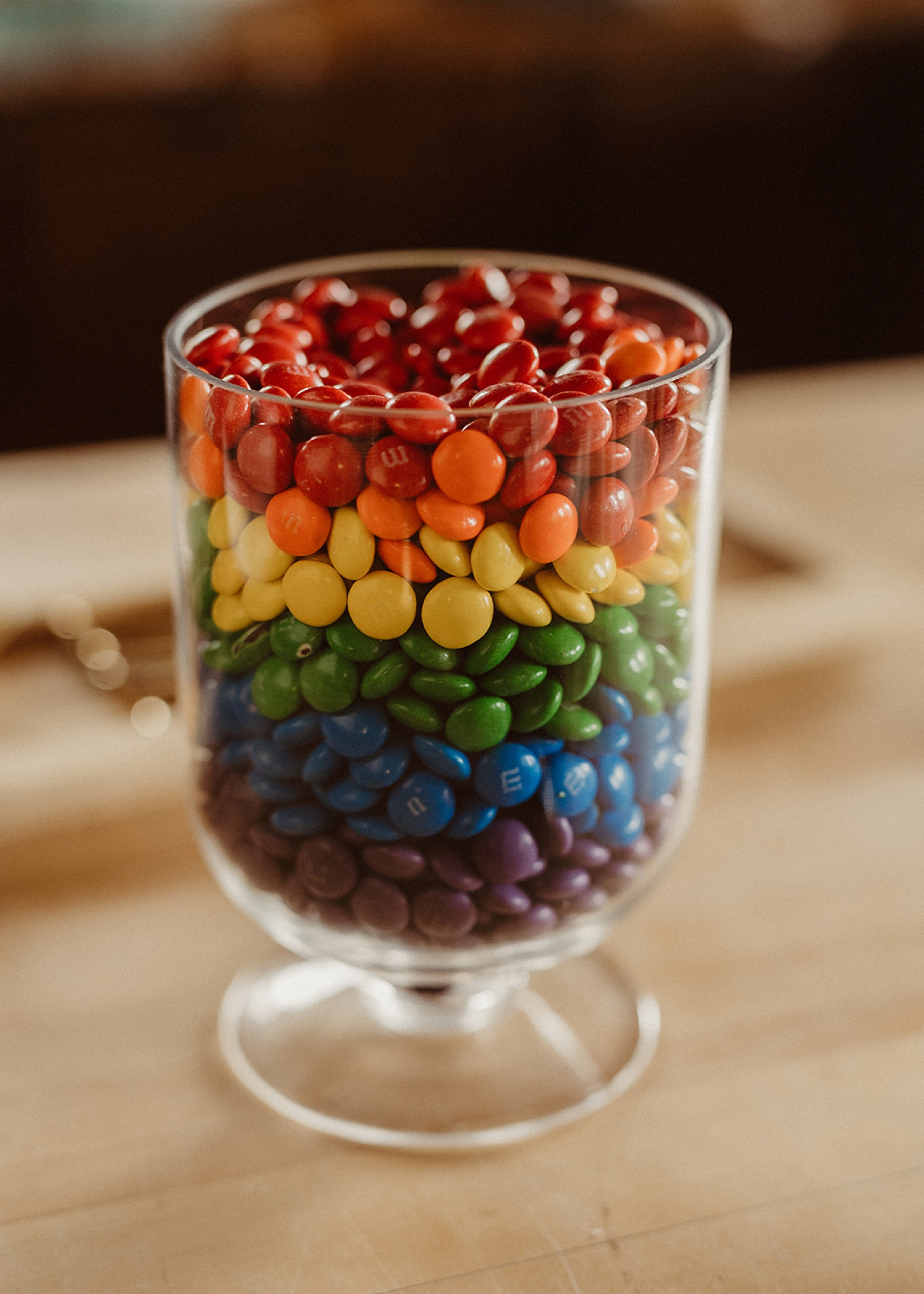 Rainbow-layered M&Ms at Colorado Airbnb wedding | McArthur Weddings and Events