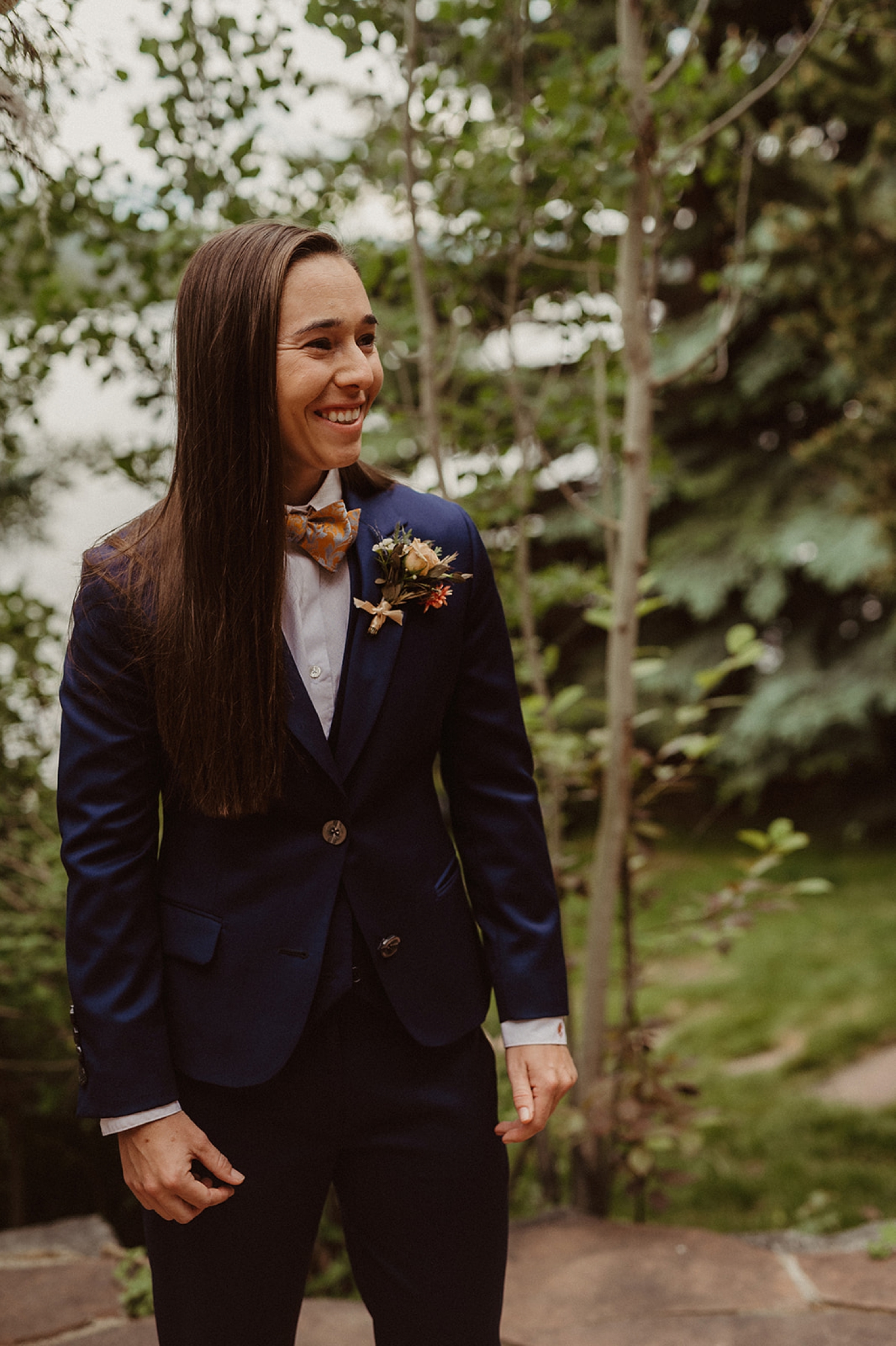 Partner watching partner walk down the aisle at Colorado Airbnb wedding | McArthur Weddings and Events