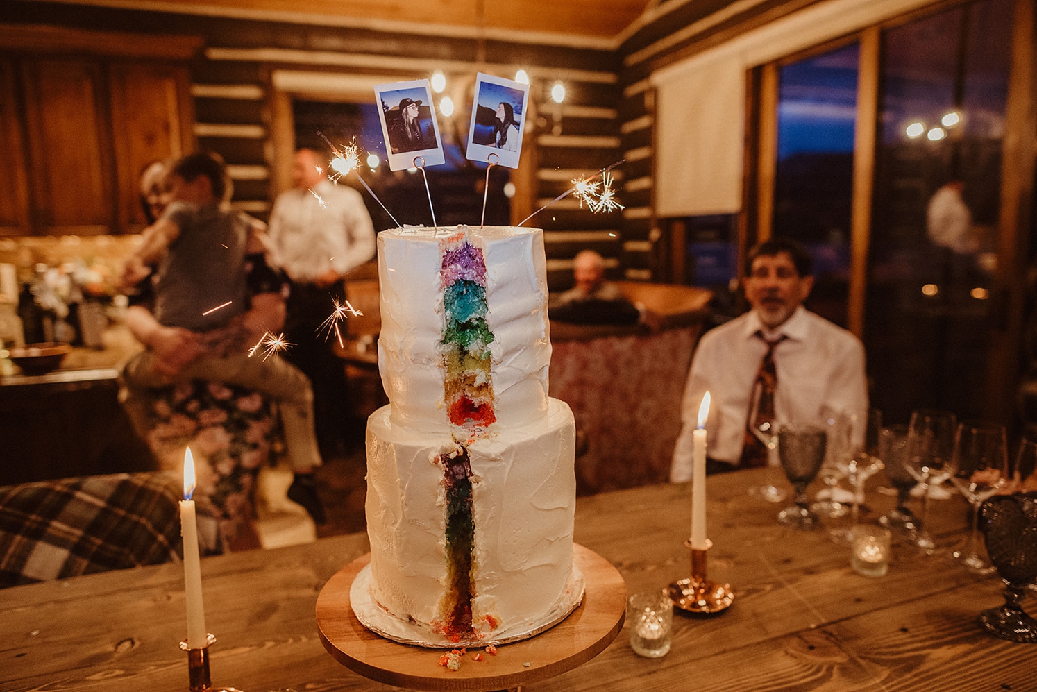 Two tier rainbow layered cake at Colorado Airbnb wedding | McArthur Weddings and Events
