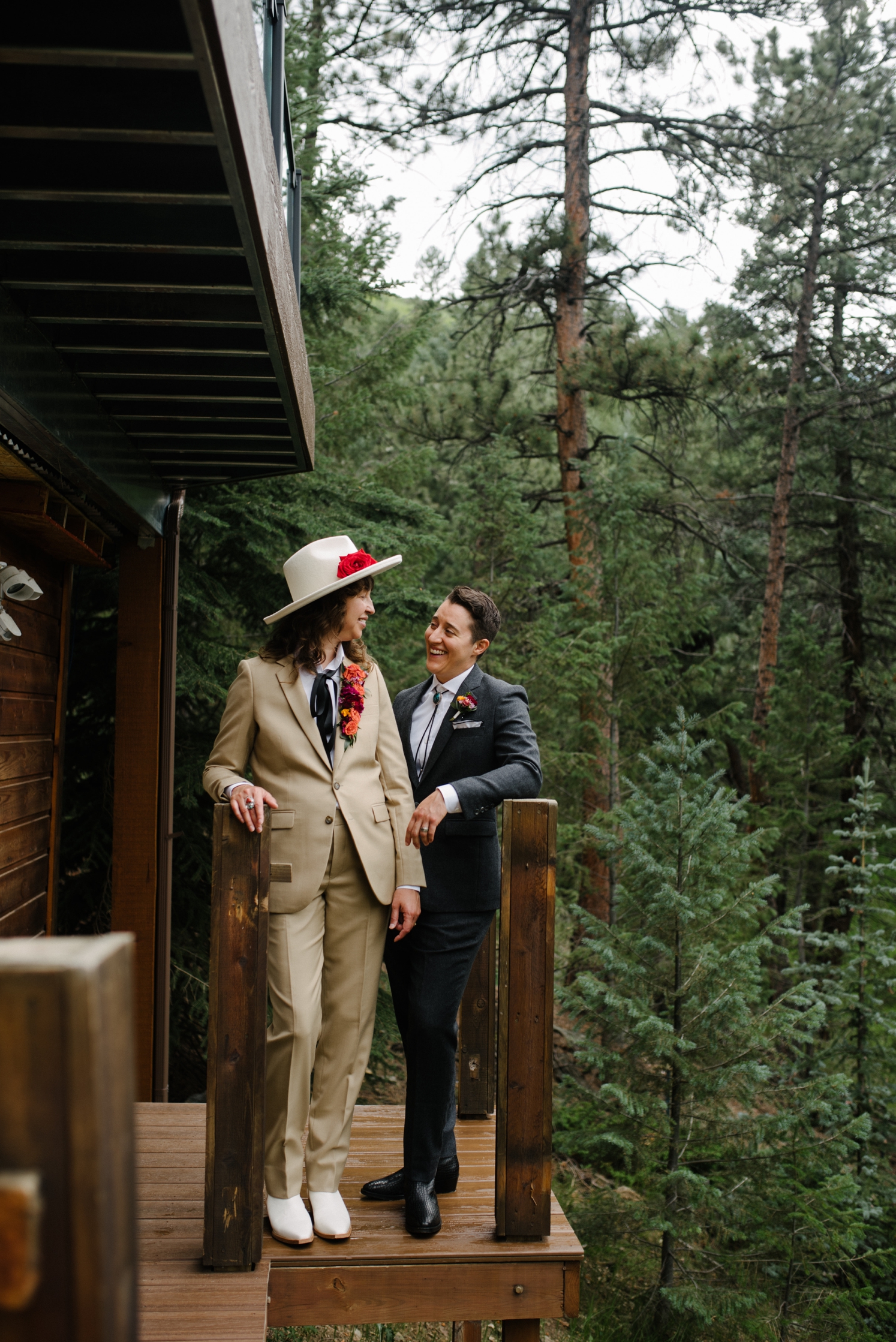 Couple standing on deck of Juniper Mountain House before wedding ceremony | McArthur Weddings and Events