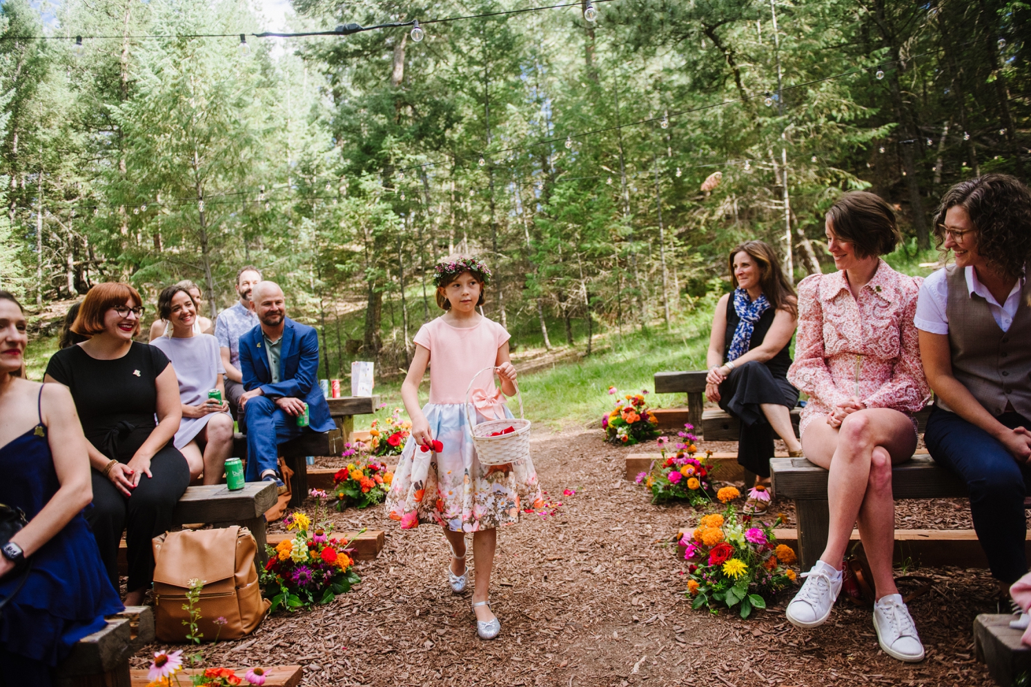 Daughter walking down the aisle at LGBTQ wedding at Juniper Mountain House | McArthur Weddings and Events