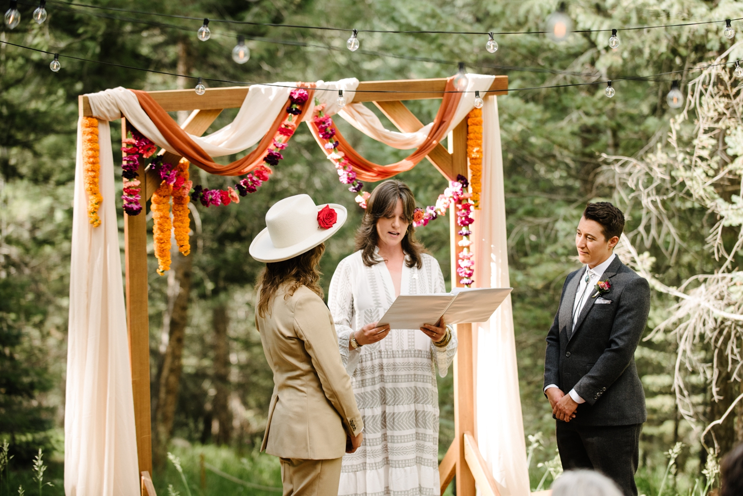 Couple looking at each other during LGBTQ wedding ceremony | McArthur Weddings and Events
