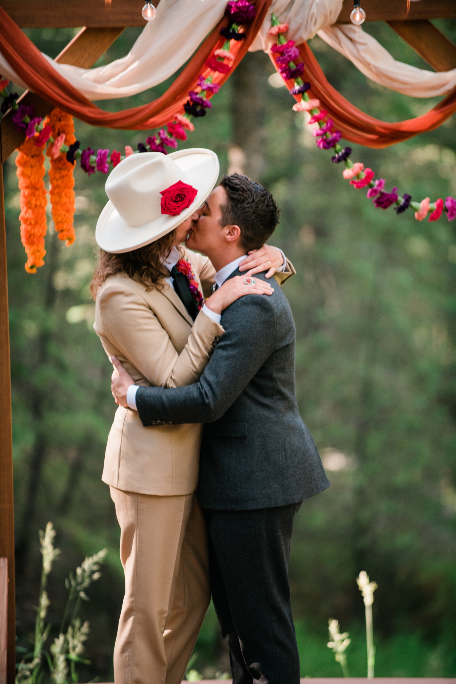 Couple kissing at the end of their LGBTQ wedding ceremony | McArthur Weddings and Events