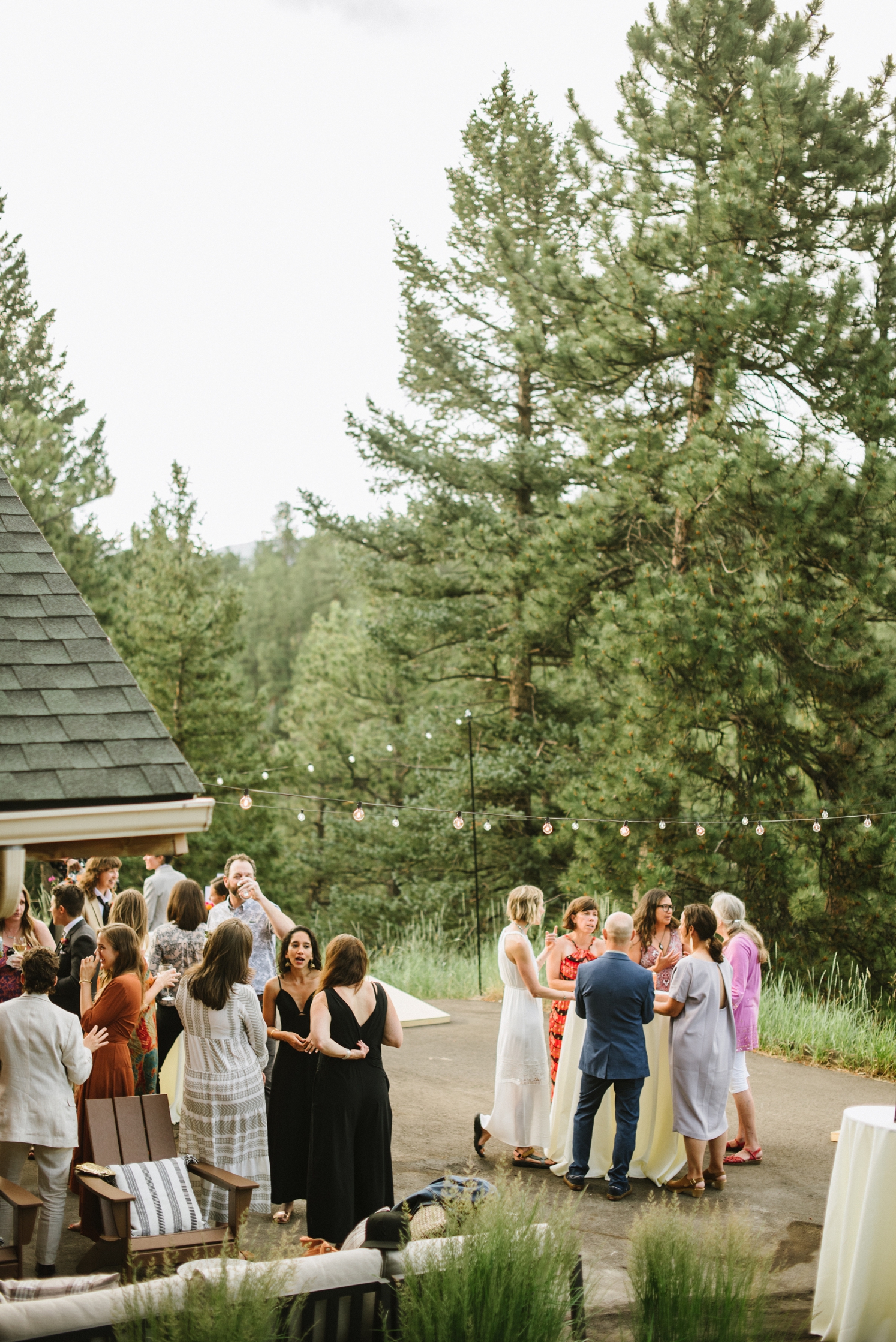 Guests enjoying outdoor cocktail hour at Juniper Mountain House | McArthur Weddings and Events