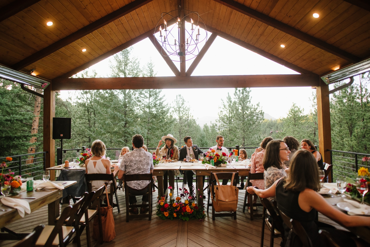 Couple enjoying dinner with guests at Juniper Mountain House | McArthur Weddings and Events