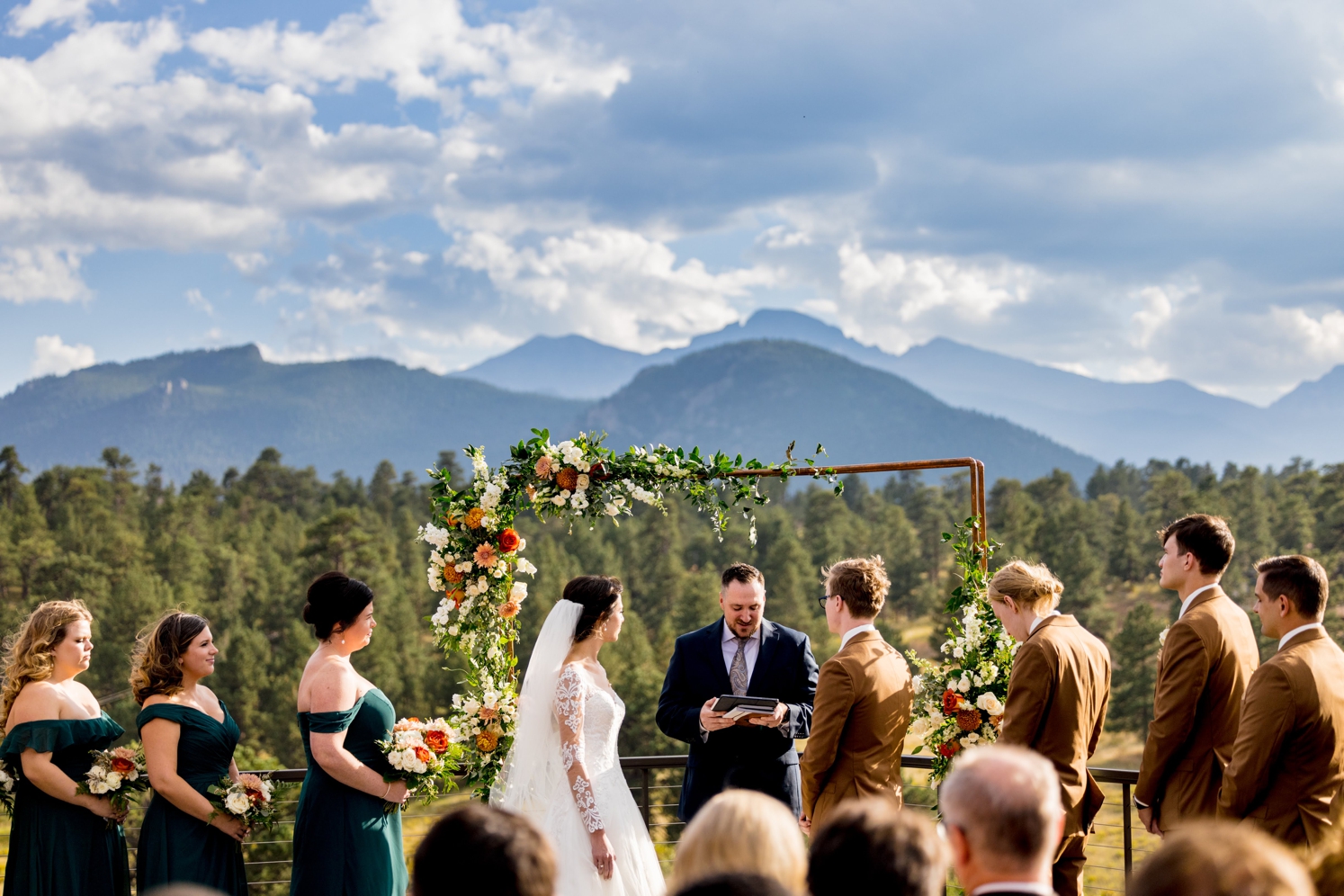 Full service wedding planner: couple getting married outside with mountains in the backdrop in Colorado | McArthur Weddings and Events