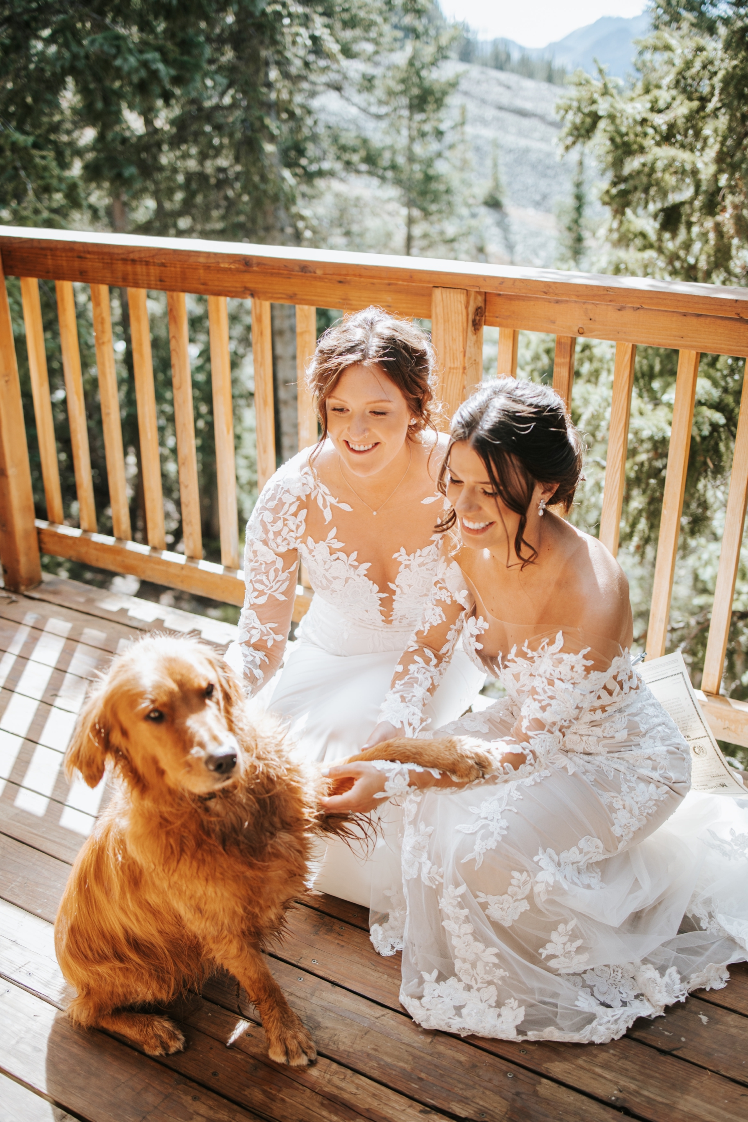 Couple petting their dog after their ceremony | McArthur Weddings and Events