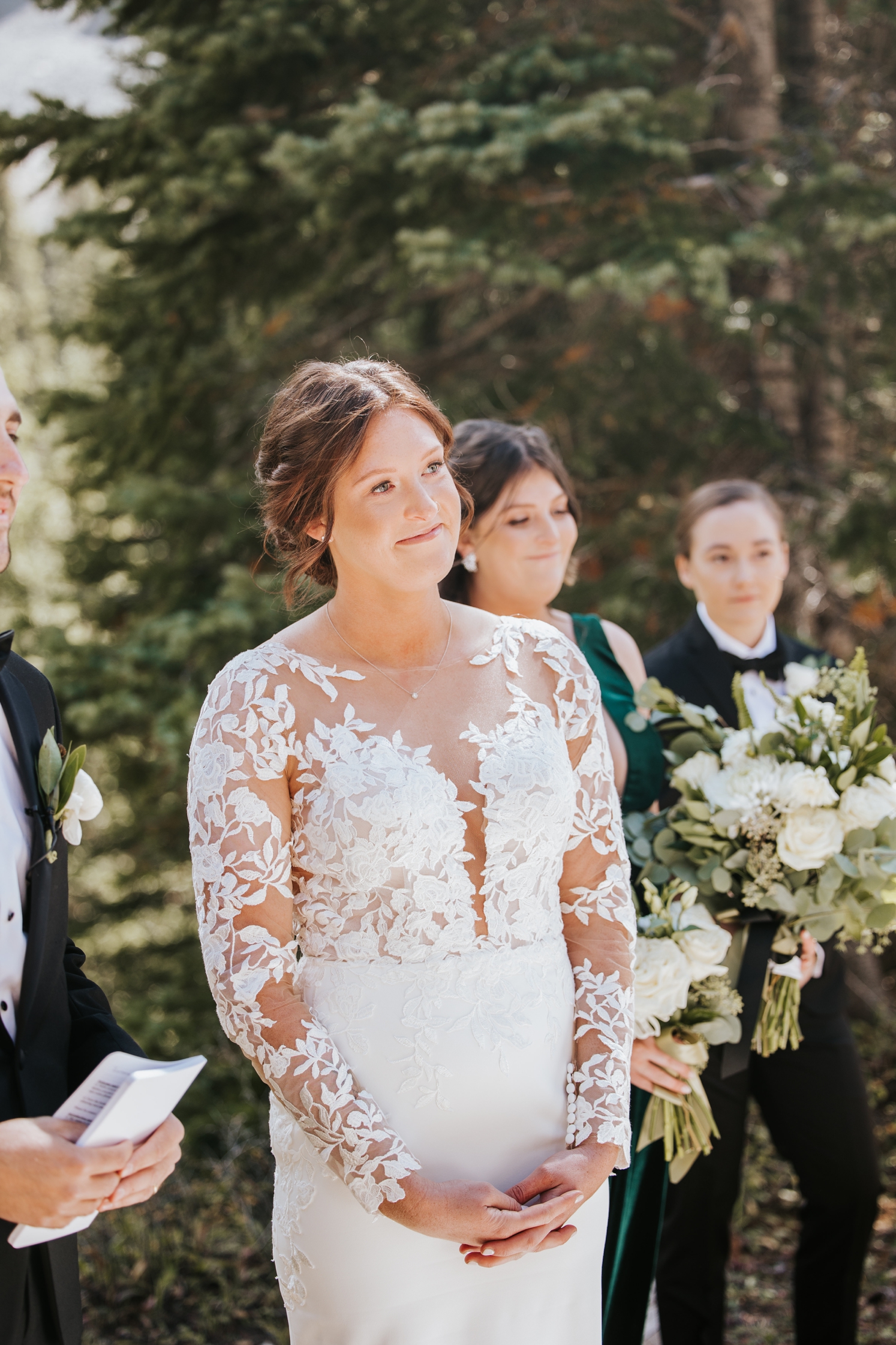 Bride watching partner walk down the aisle at Telluride wedding | McArthur Weddings and Events