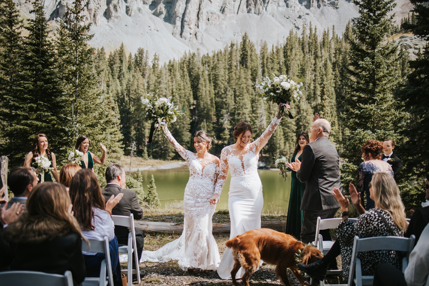 Couple walking down aisle after ceremony with dog in front of them | McArthur Weddings and Events