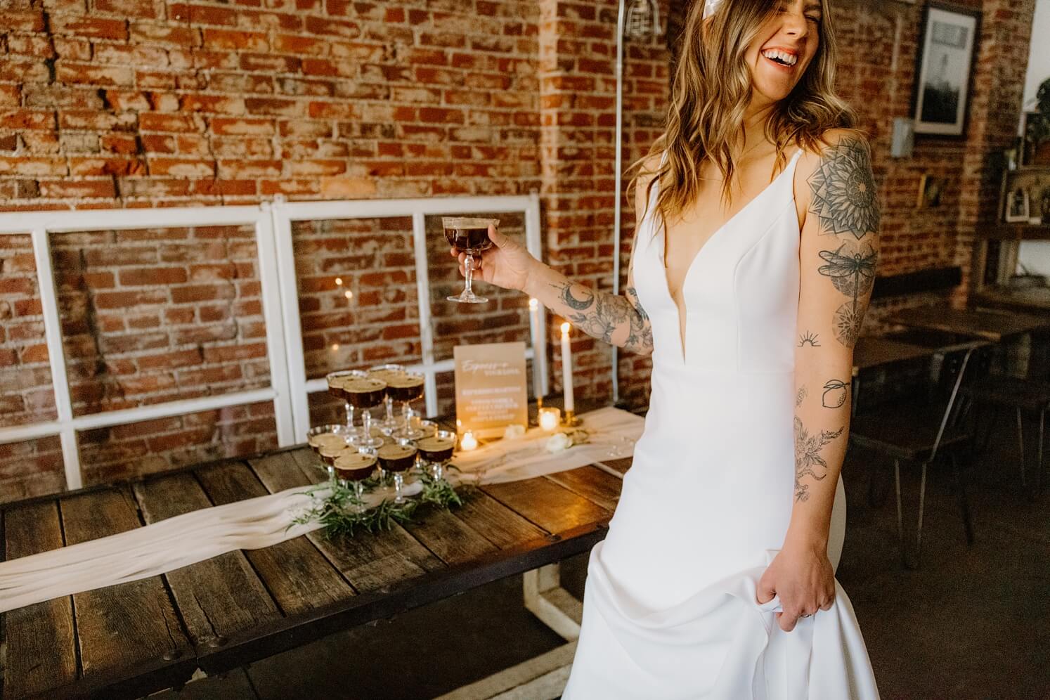 Bride holding espresso martini next to espresso martini tower | McArthur Weddings and Events