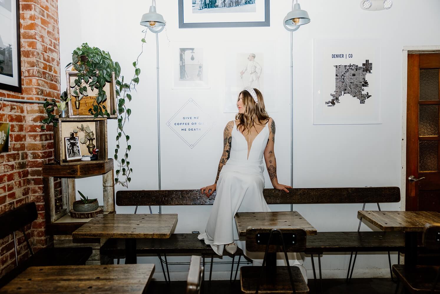 Bride sitting on bench at Queensbury Rules Coffee House | McArthur Weddings and Events
