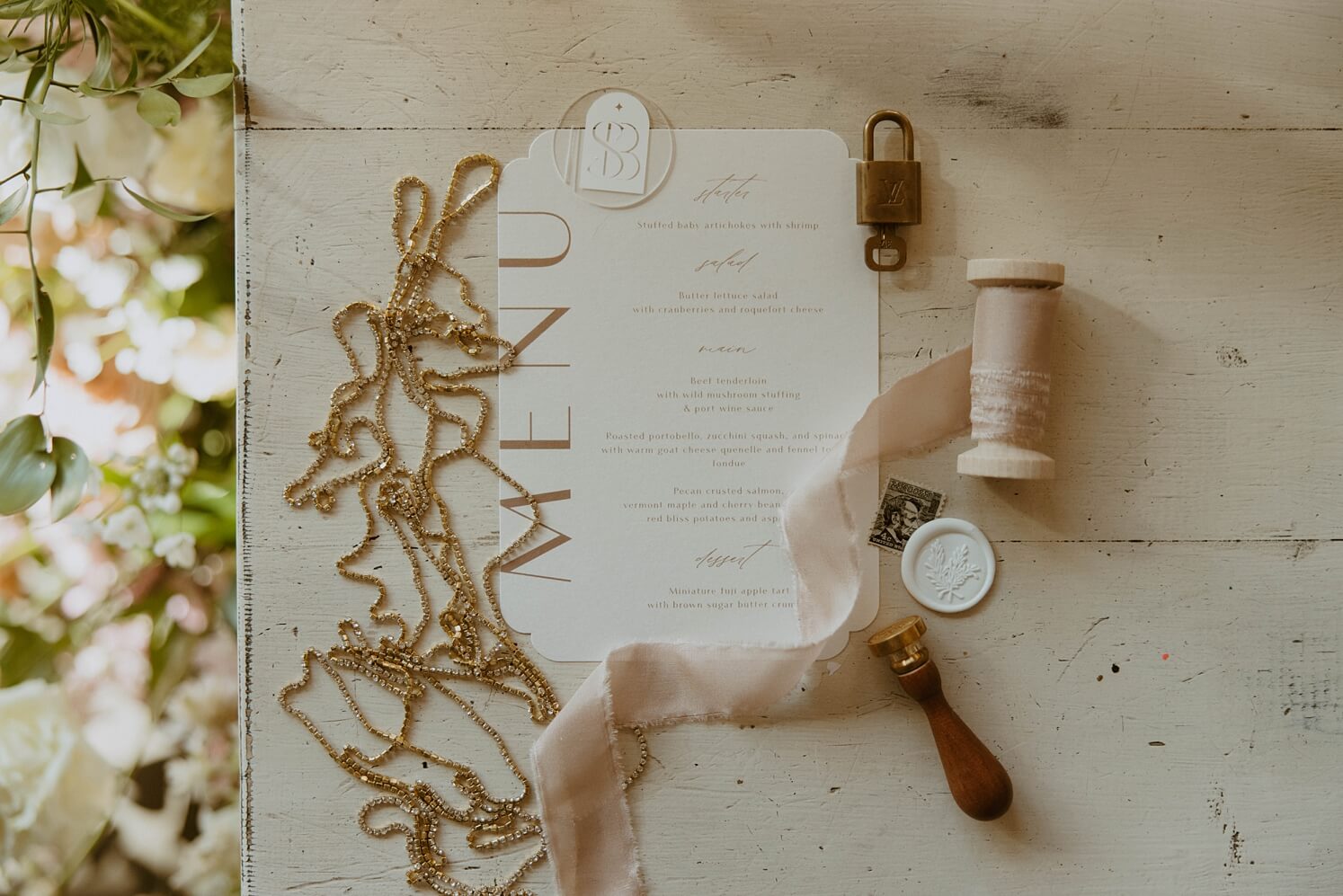 White menu with gold and pink accessories | McArthur Weddings and Events