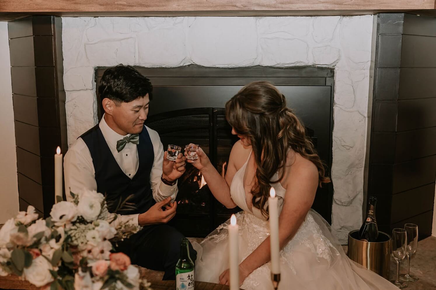 Bride and groom toasting with soju at Colorado elopement | McArthur Weddings and Events