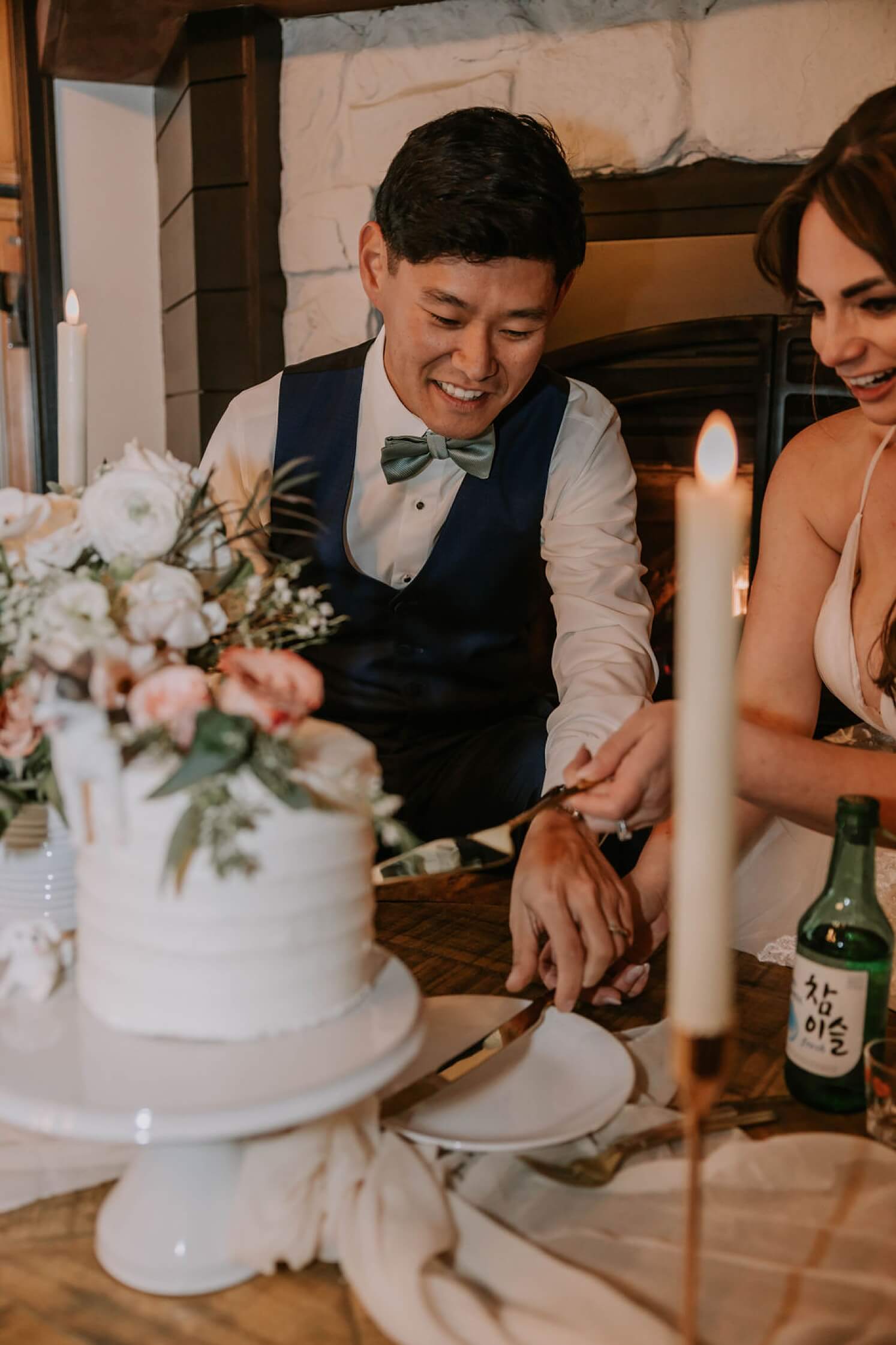Bride and groom cutting cake at Colorado elopement | McArthur Weddings and Events