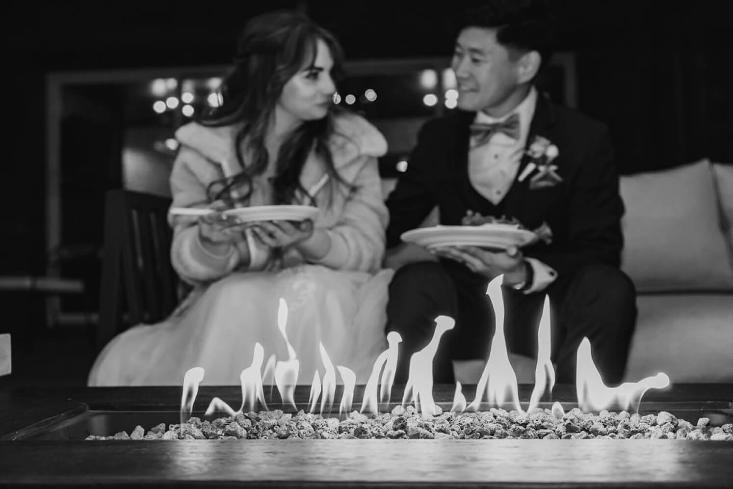 Bride and groom sitting at fire pit at Juniper Mountain House after Colorado elopement | McArthur Weddings and Events