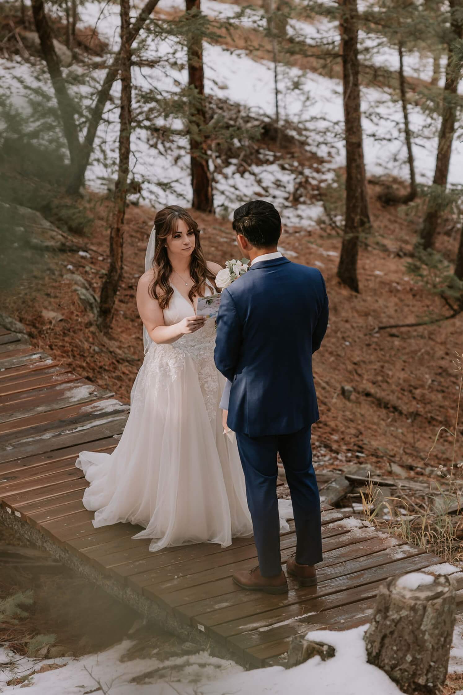 Bride reading vows to groom at Juniper Mountain House | McArthur Weddings and Events