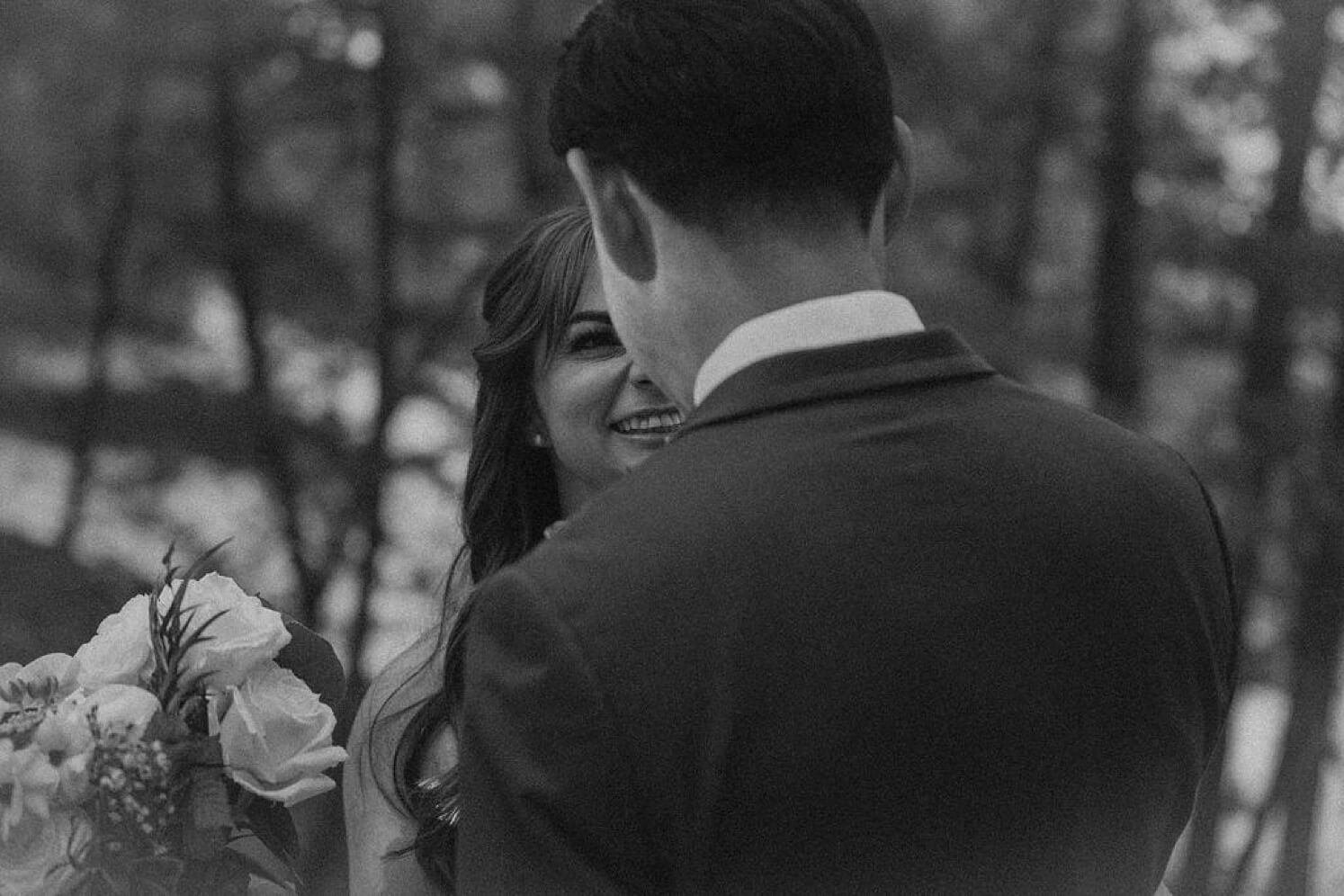 Bride and groom looking at each other after Colorado elopement | McArthur Weddings and Events
