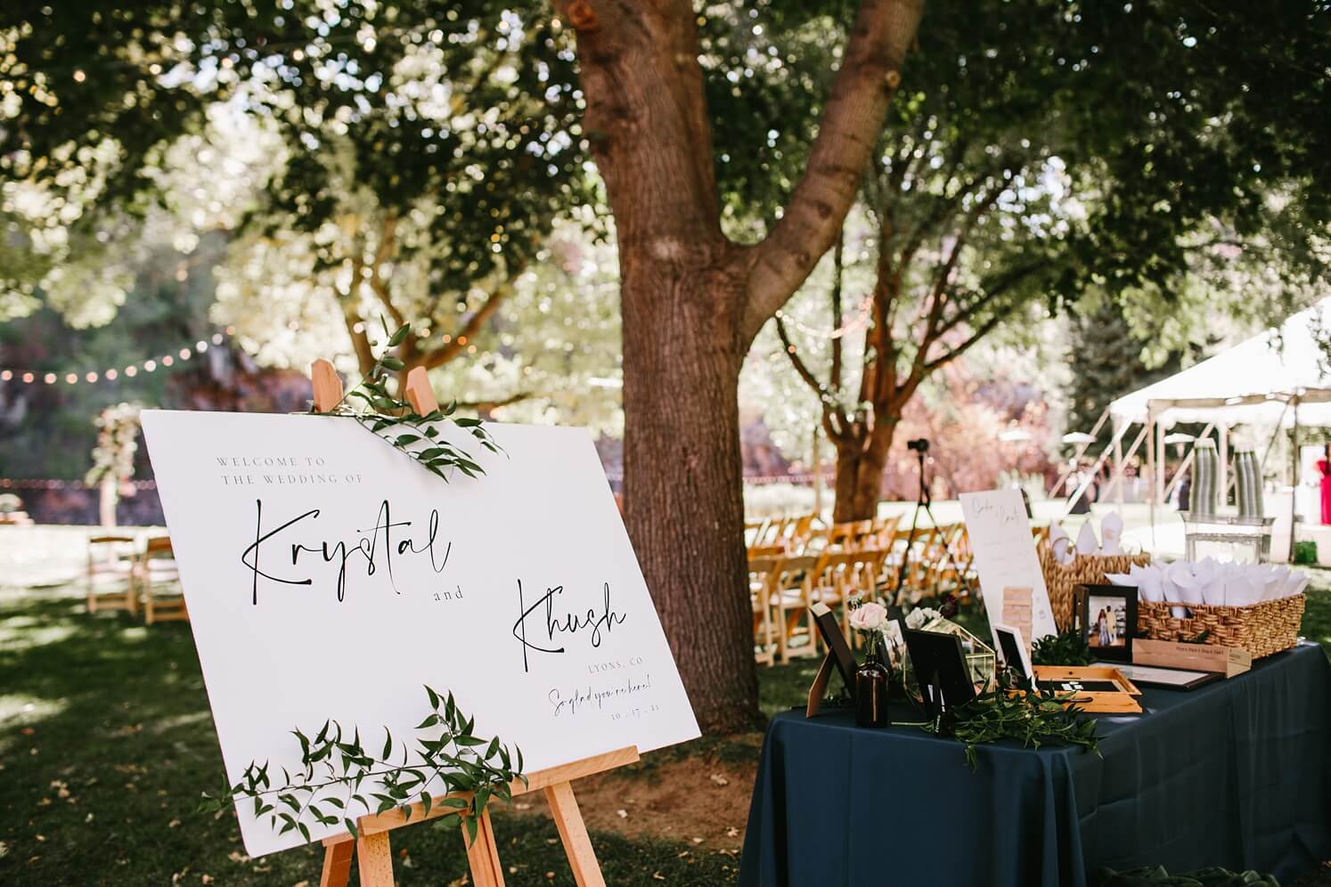 White wedding welcome sign with greenery | McArthur Weddings and Events