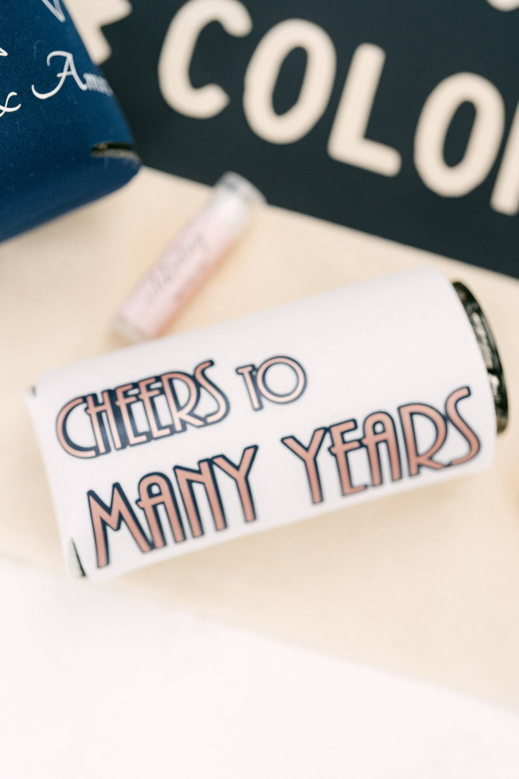 Colorado wedding welcome bags with koozie that says cheers to many years