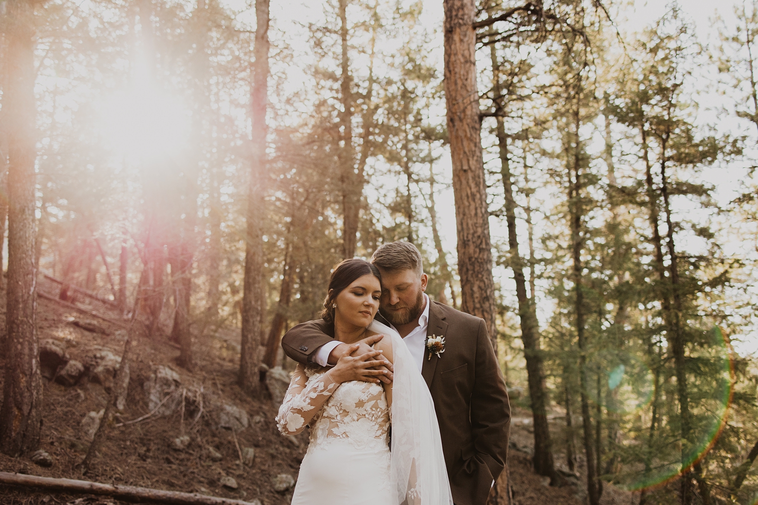 Couple standing in forest at Evergreen wedding venue | McArthur Weddings and Events