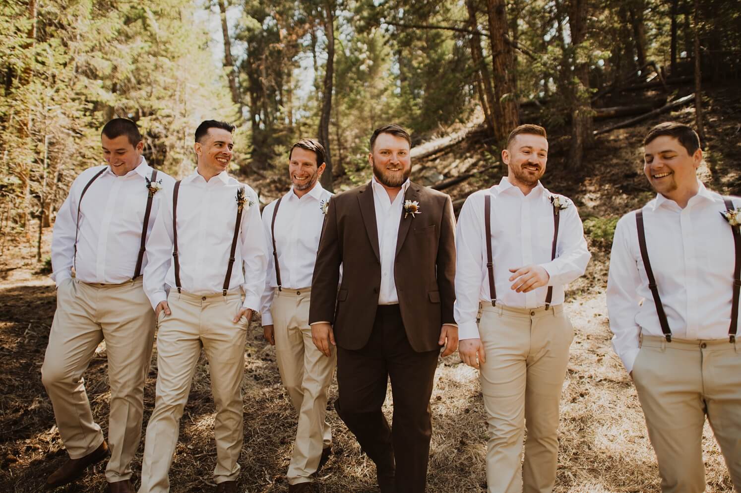 groom walking with groomsmen at Evergreen wedding venue | McArthur Weddings and Events