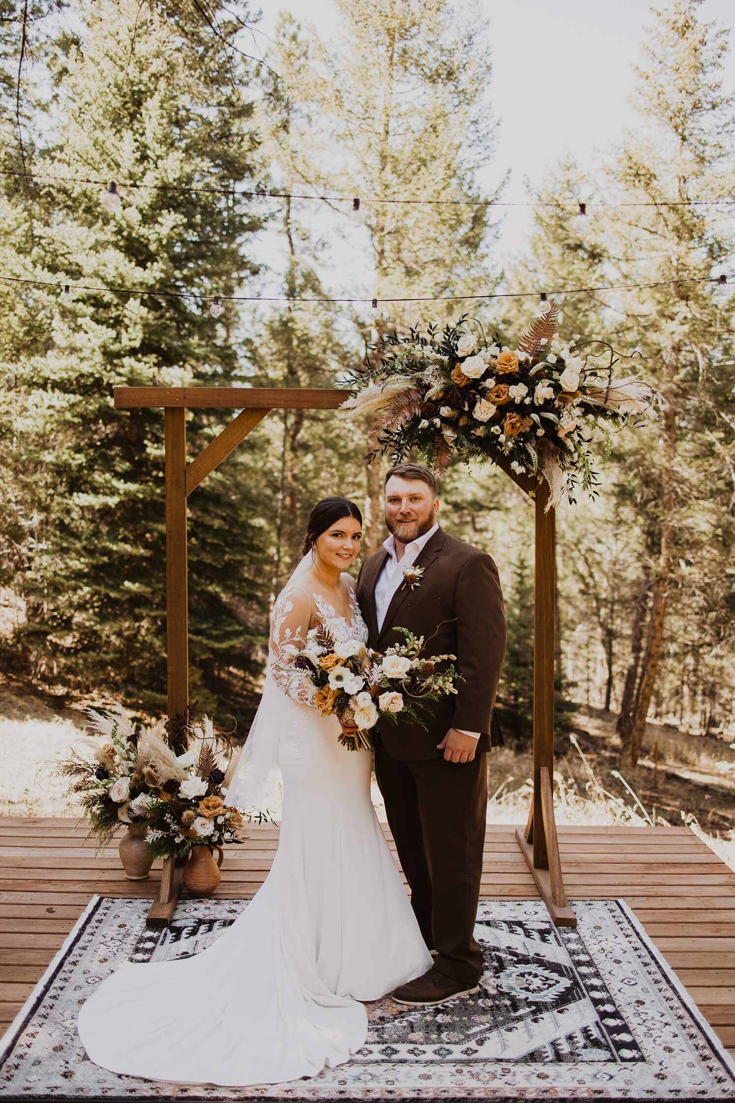 Bride and groom standing at altar at Evergreen wedding venue | McArthur Weddings and Events