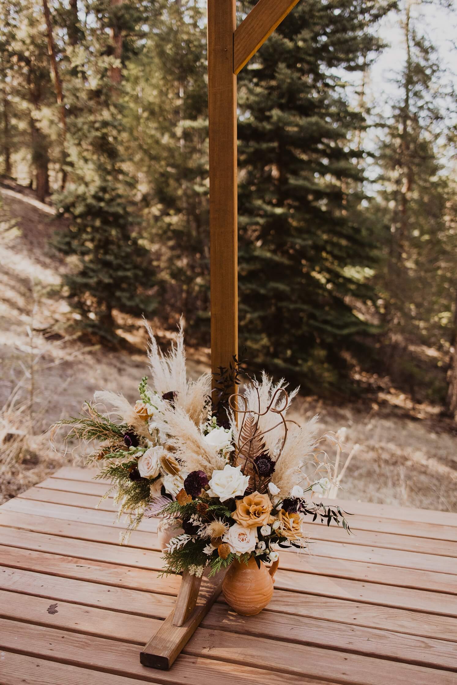 Boho floral arrangements in terracotta vases at Juniper Mountain House | McArthur Weddings and Events