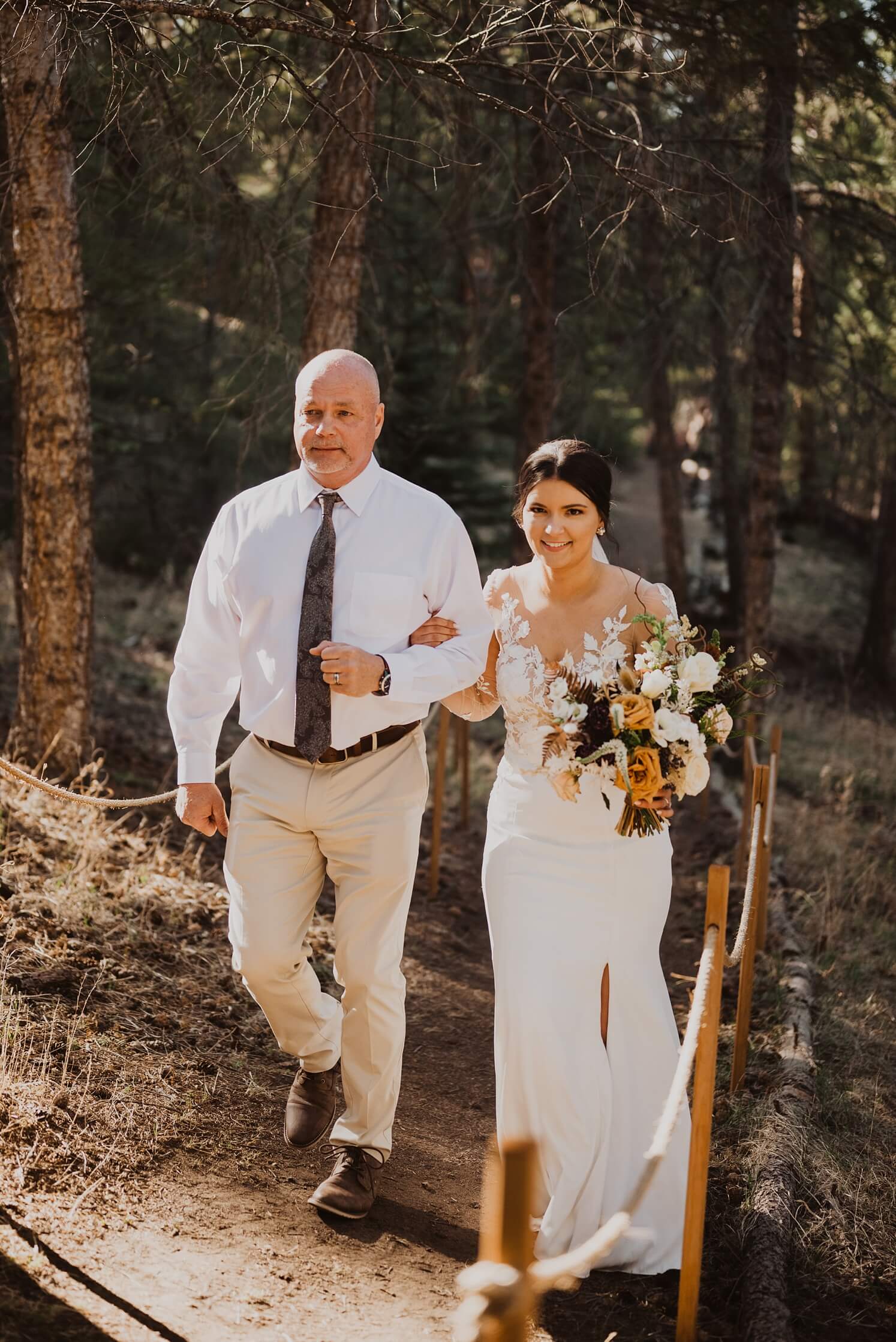 Bride walking down the aisle with father at Juniper Mountain House | McArthur Weddings and Events