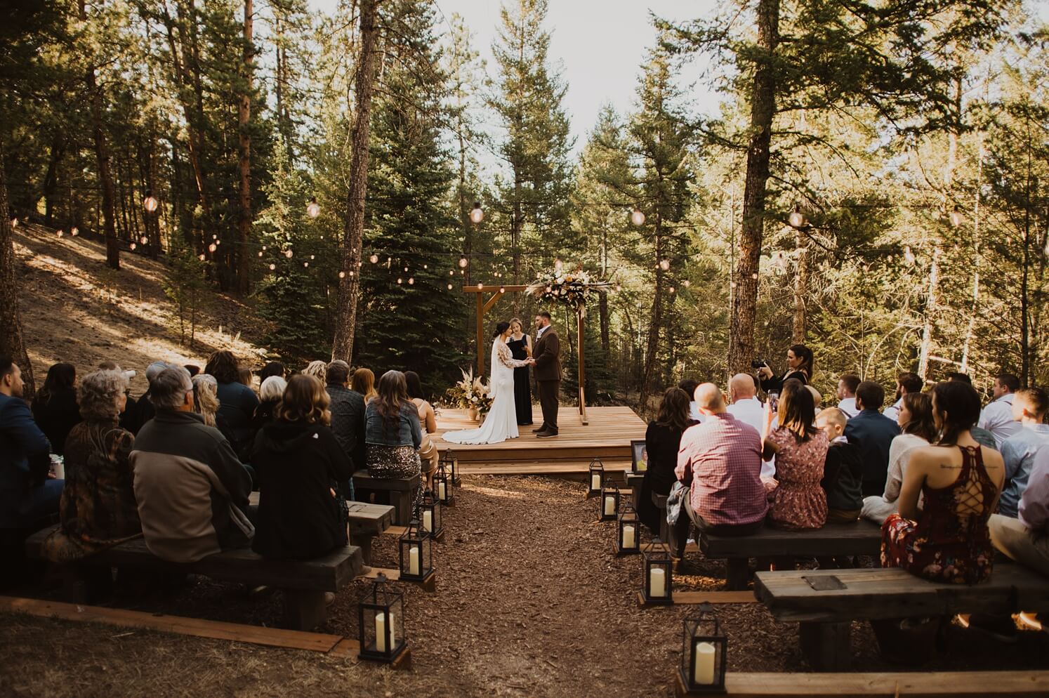 Bride and groom exchanging vows at Evergreen wedding venue | McArthur Weddings and Events