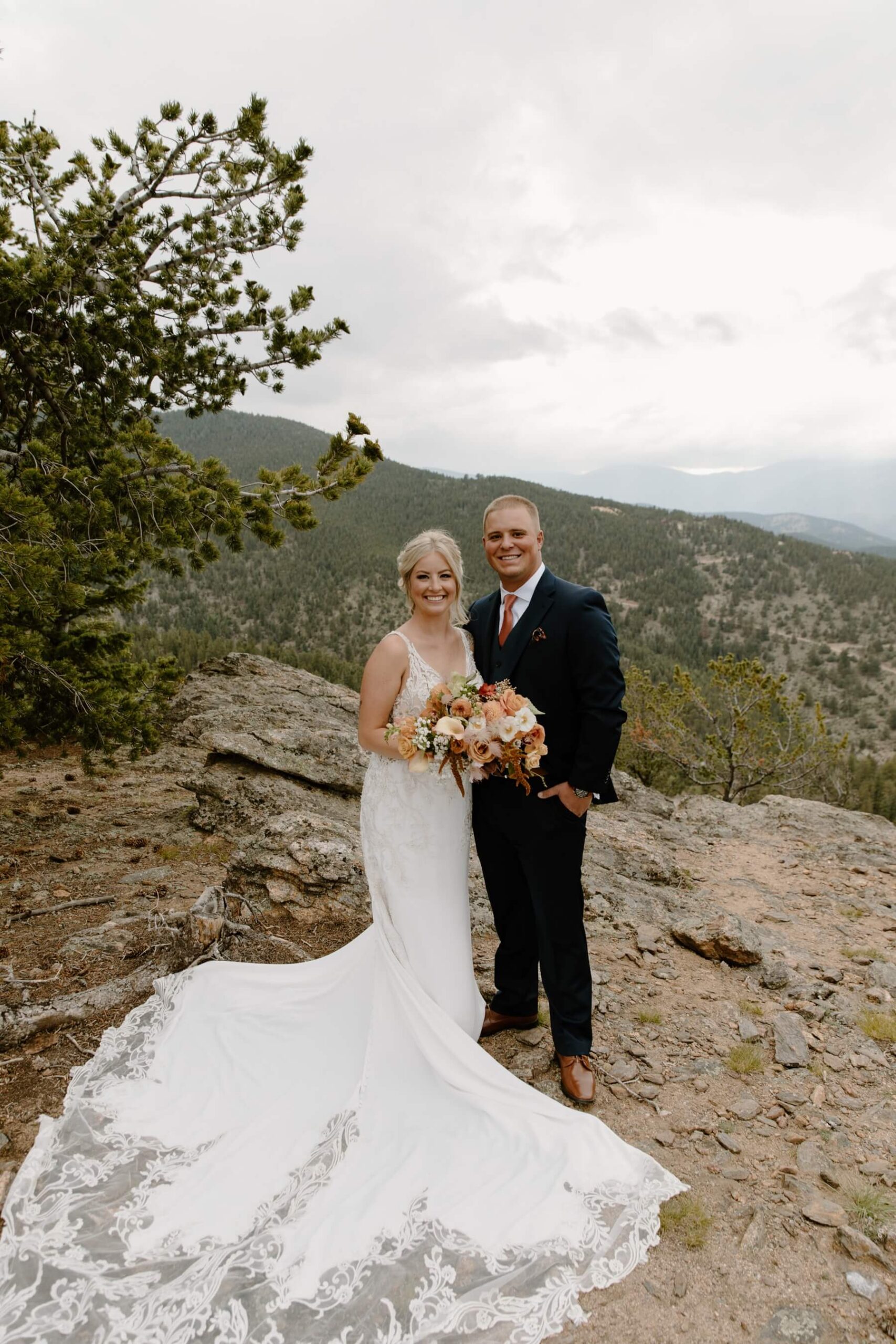 Bride and groom standing in front of mountains at North Star Gatherings | McArthur Weddings and Events