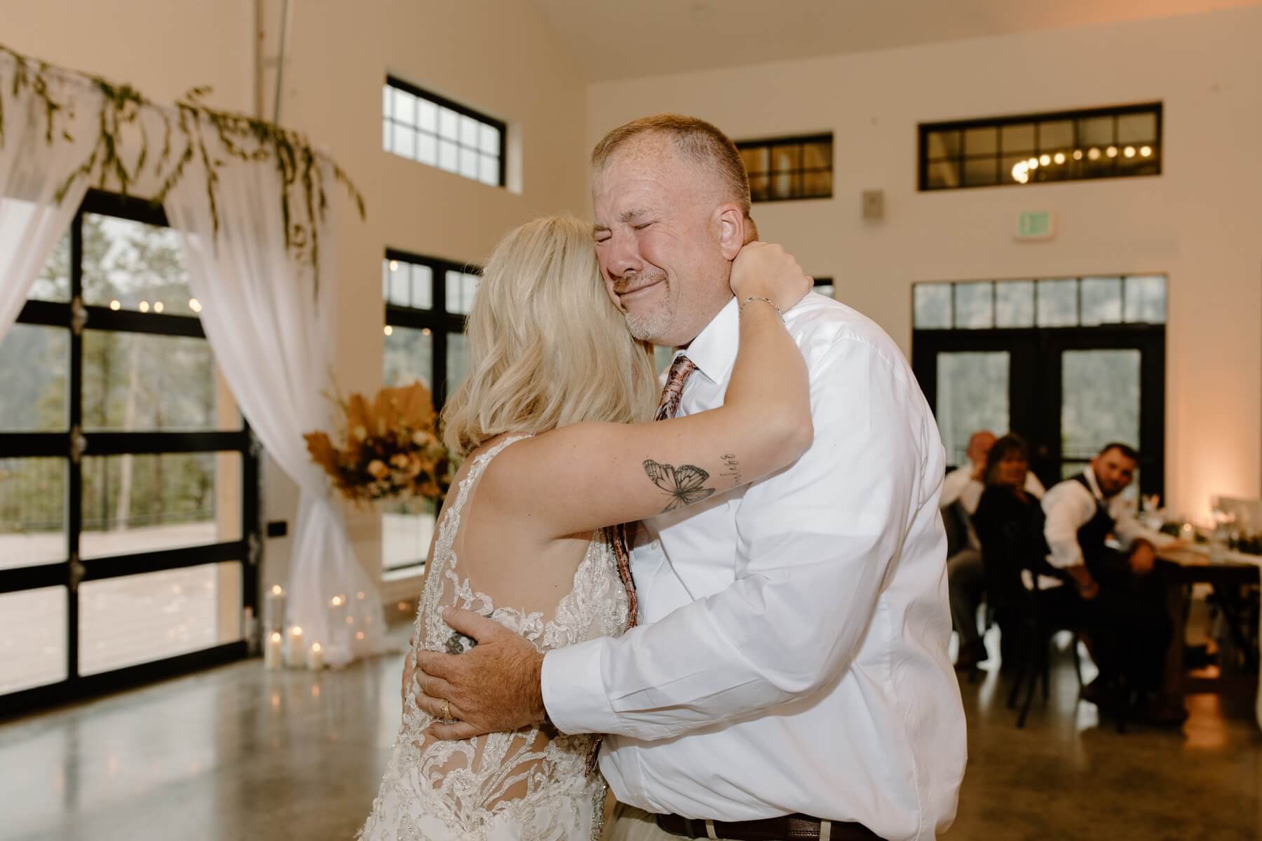 Bride dancing with father during reception at idaho springs wedding venue | McArthur Weddings and Events