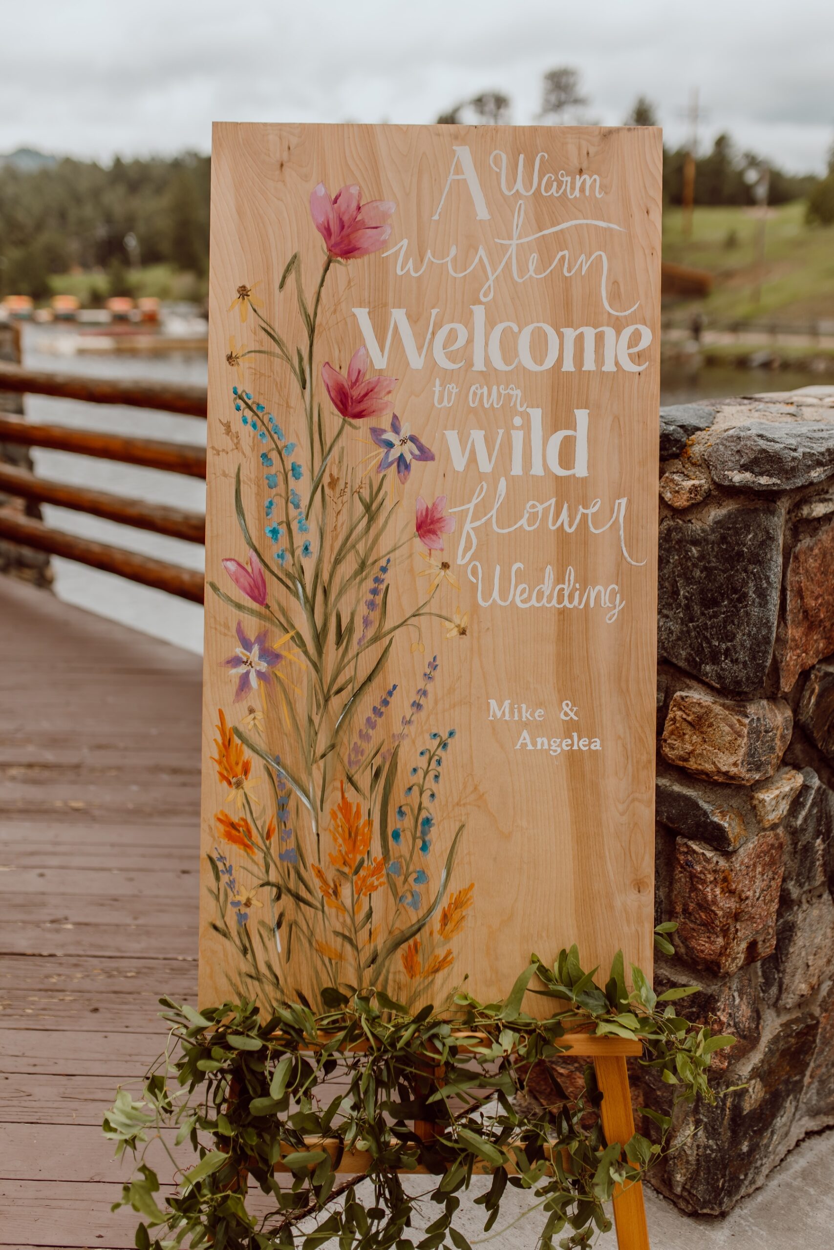 Handpainted wedding welcome sign with western and wildflower touches