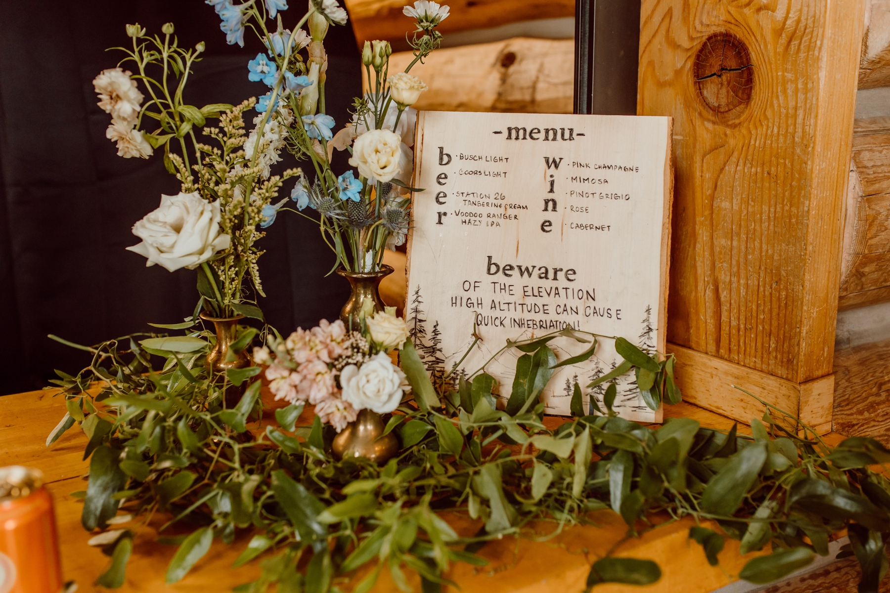 Handmade wood bar sign with wildflowers 
