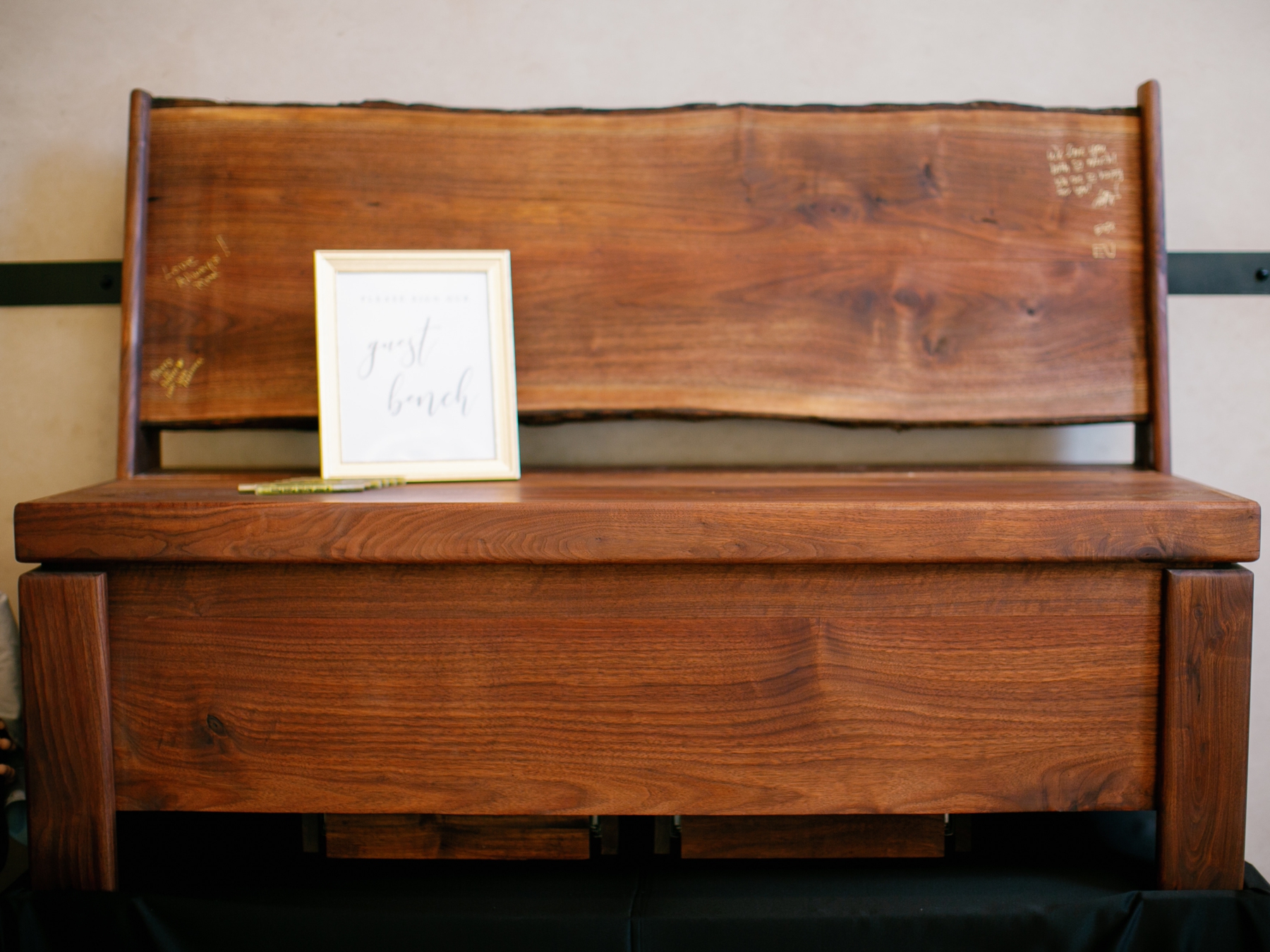 Wooden bench used as wedding guest book
