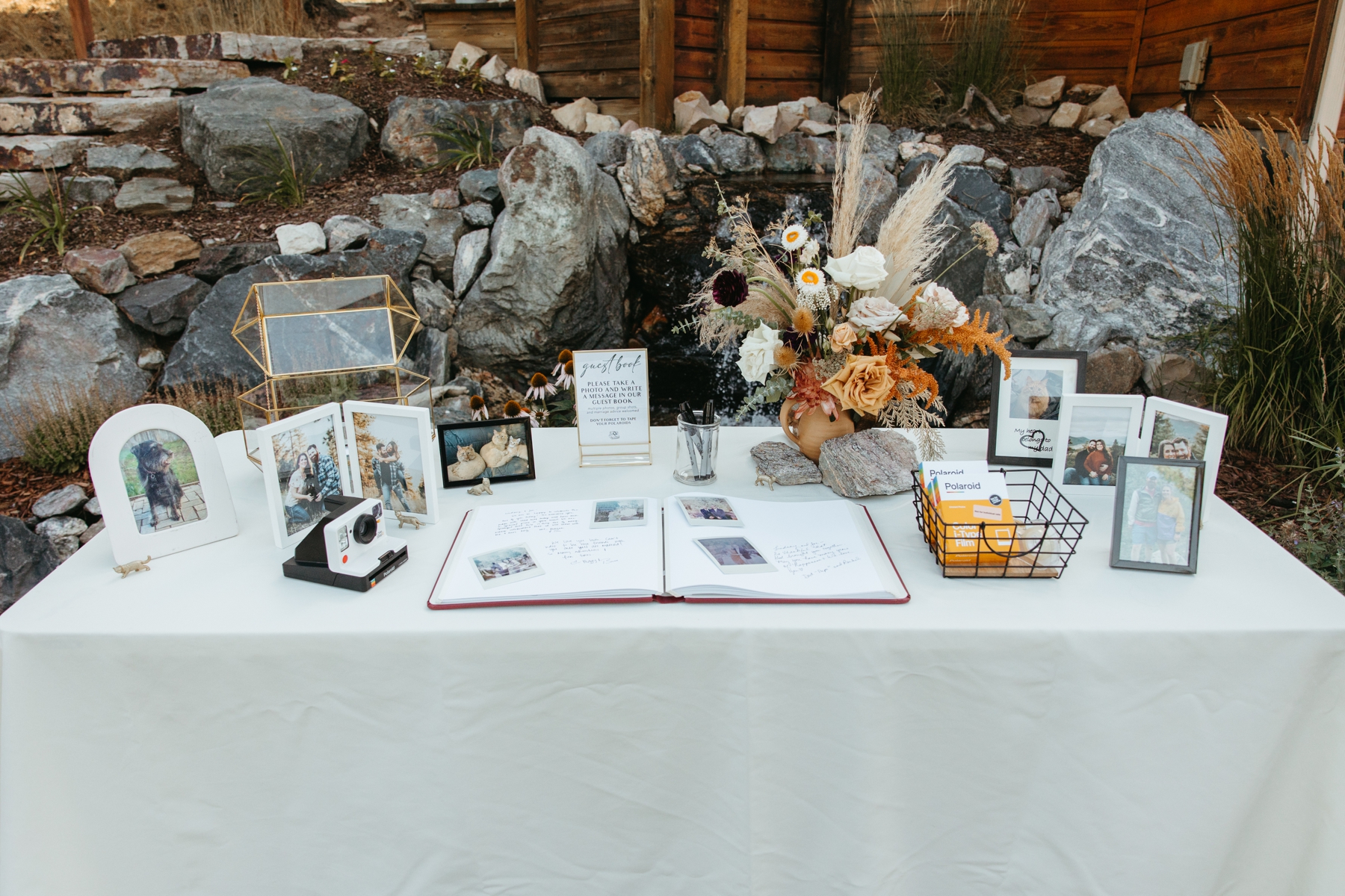Welcome table at wedding with polaroid 