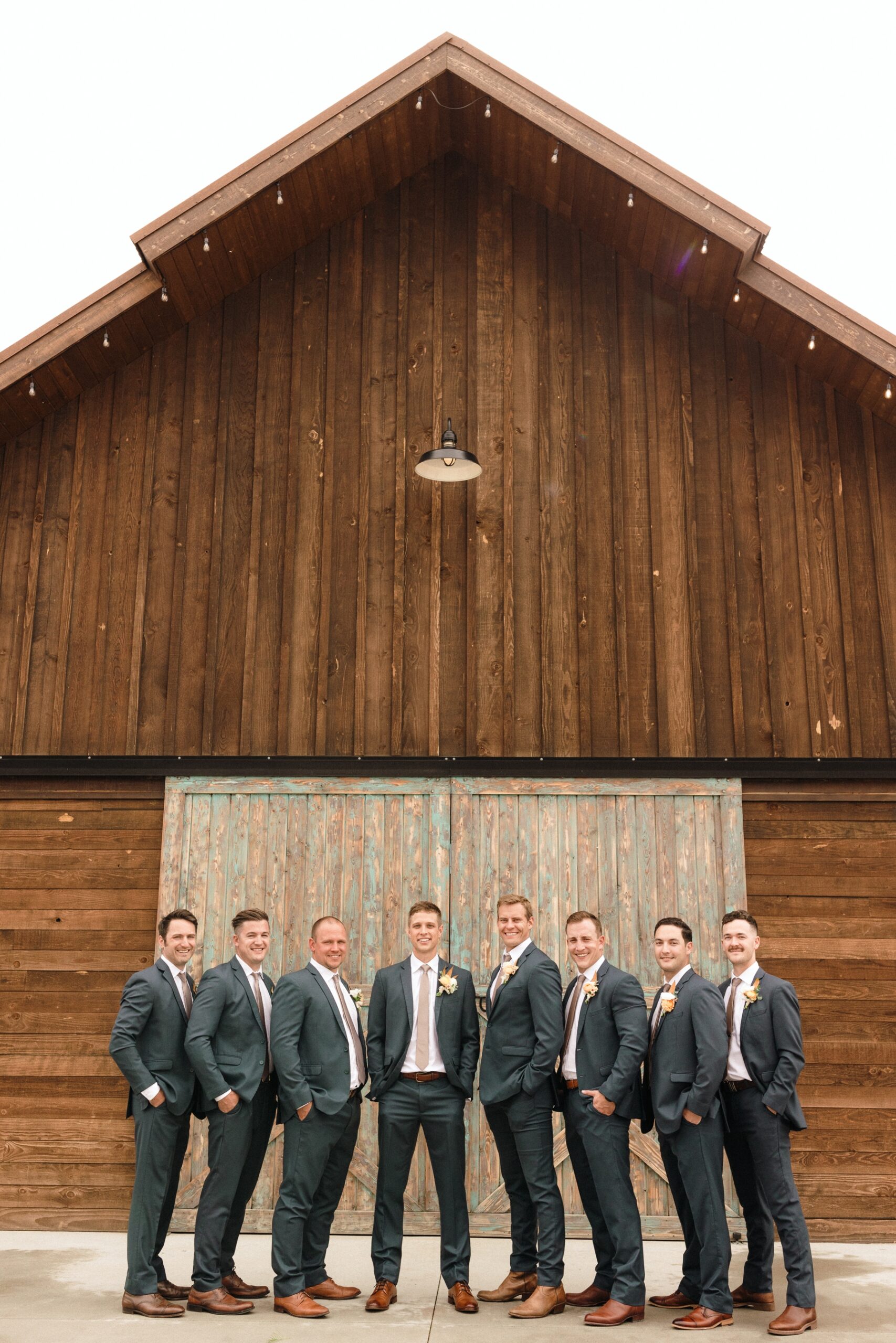 Groom with groomsmen in gray suits