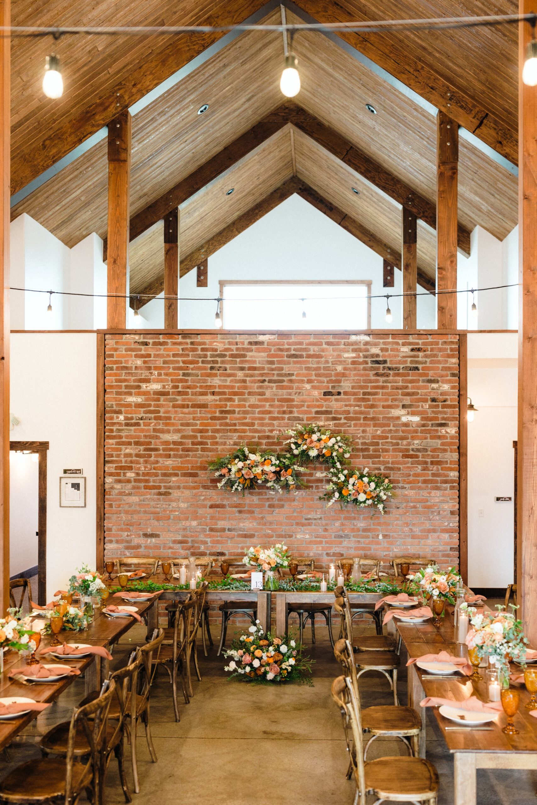 Wedding reception with peach and pink details at The Barn at Sunset Ranch